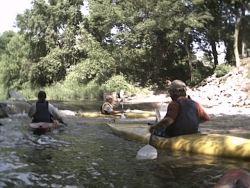 Eric practices an eddy turn below the Veenker dam; Scott & Dave wait for their turn