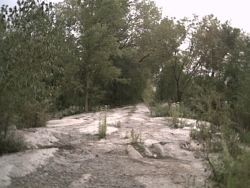 concrete - Fortified dike between pond and river